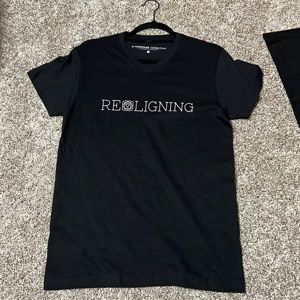 Black “realigning” tshirt